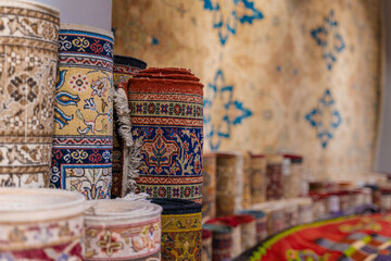 Traditional Turkish carpets are offered for sale at a bazaar