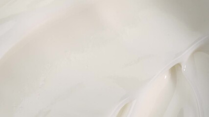 A woman takes a white face cream from a glass jar with her finger, macro. The concept of skin care for the body and face. - Powered by Adobe