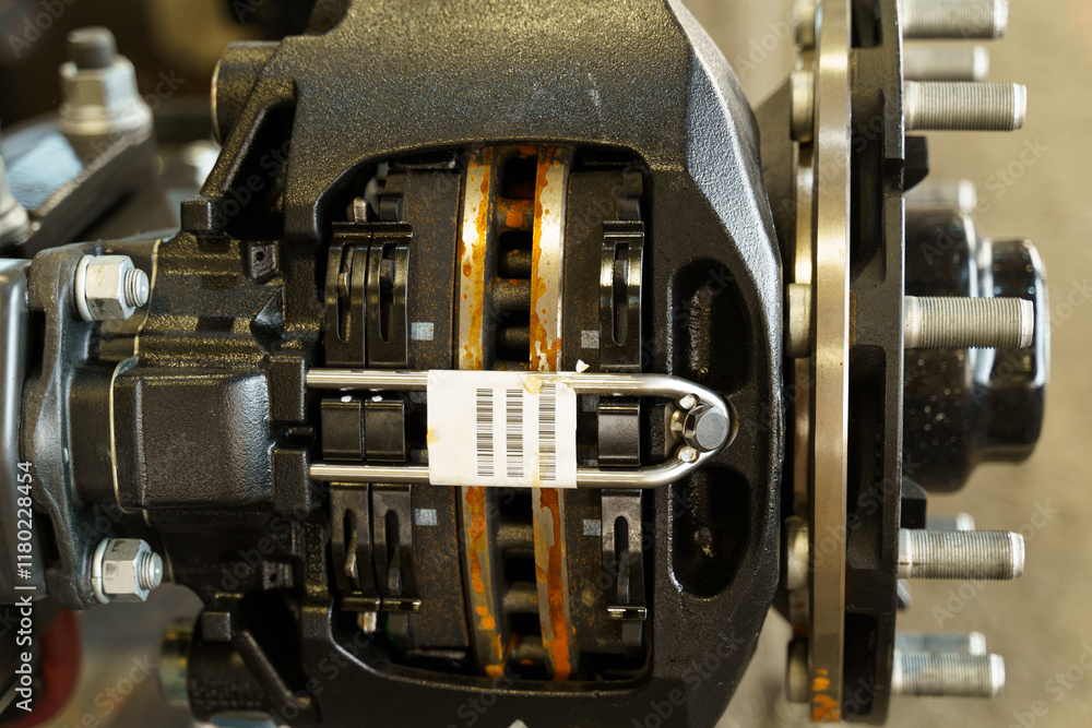 Fototapete Close-up view of a brake system showcasing intricate components and details