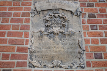 Epitaph plaque on wall of Cathedral of Exaltation of Holy Cross. Opole, Poland.