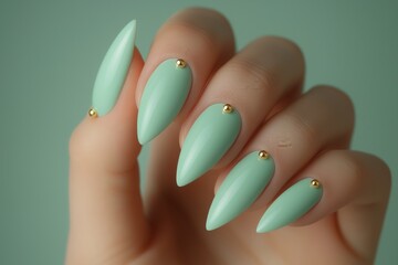 Hands showcasing elegant matte mint green nails with gold accents in a simple studio setting. Generative AI