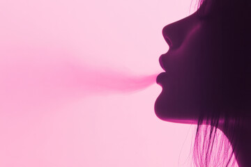 Fototapeta premium A woman is smoking a cigarette and the smoke is coming out of her mouth