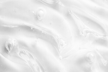 Cosmetic gel, serum transparent sample. Liquid cream with bubble texture. Gel texture of a cosmetic product. Clear liquid lotion for skin care.