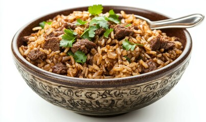 Browned beef and rice in a flavorful stir fry, served in a bowl with a spoon on the side.