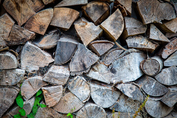 Pile of seasoned chopped firewood. Background. Graphic resource.
