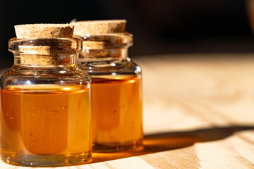 bottles of honey on the table, sunlight