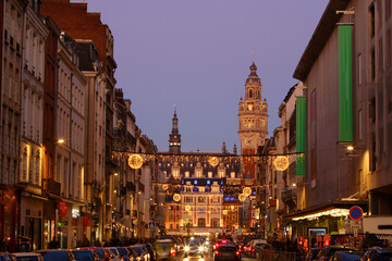 Fototapeta premium Lille, old facades in the center, the belfry of the Chamber of Commerce in background at Christmas. France.