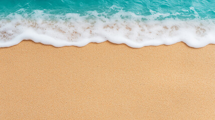 Foamy turquoise ocean waves gently meeting a smooth golden sandy beach