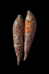 Sweet Potatoes on Black Background