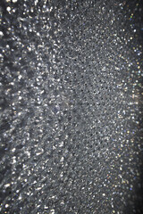 Holiday background. Silver Bokeh background. Glitter bokeh background. Glitter texture abstract background. Abstract Holiday. Bokeh backgrounds. Abstract backgrounds with copy.