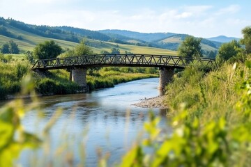 Fototapeta premium Wooden bridge over river, mountain view, summer