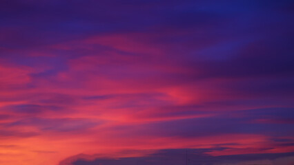 Background of a crimson sunset sky. Soft focus