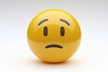 Fototapeta premium A yellow emoticon expressing disappointment or worry, conveying a feeling of unease.