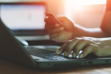 Online shopping concept. Businessman holding credit card and typing on laptop for online shopping...
