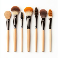 Set of various makeup brushes arranged neatly, showcasing different shapes and sizes for diverse cosmetic applications.