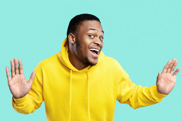 Funny Curious African American Guy Looking And Listening To You Posing Near Invisible Glass Wall...