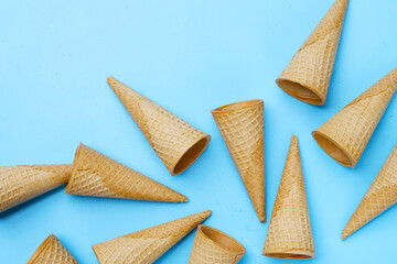 Waffle cones on blue background