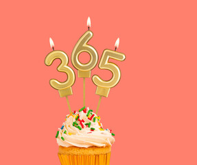Three candles forming the number 365 - Pink background.