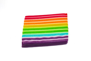 rainbow layer cake isolated on white background