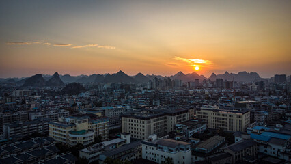 A sunset aerial view of Guilin city with karst mountains in the back. China © Ignacio