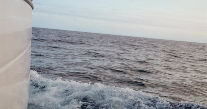 Starboard hul on a sailboat cutting trough the ocean while crossing the Bay of Biscay Stock Footage