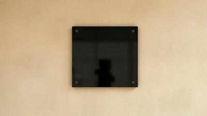Sleek black glass sign on a rustic textured wall, signage, blank sign, texture