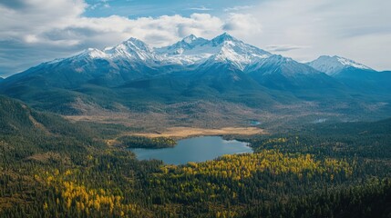 Obraz premium Aerial view Autumn lake, snow-capped mountains, forest, clear sky, travel brochure