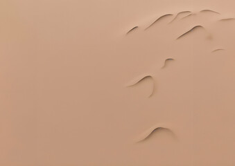 Natural sand dune texture with smooth, flowing ripples in a beige color, creating an organic and minimalist pattern