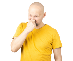 Disgusted Man in Yellow Shirt Holding Nose with Unpleasant Expression