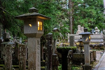 Koyasan cemetery in Japan. Amazing lanterns and atmosphere. Foggy trees.