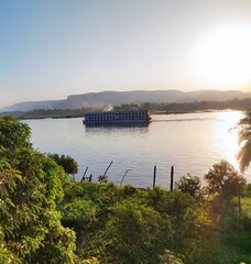 lake at sunset Sun, river and ship