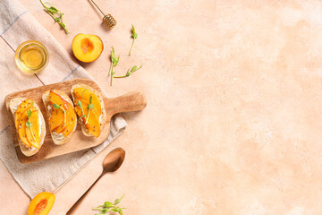 Wooden board of peach bruschetta with ricotta, flax seeds and micro green on beige background