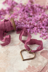 Red Bud Blossoms Surrounding a Hear-Shaped Locket on Ribbon