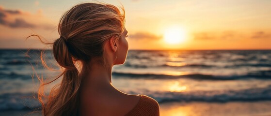 Fototapeta premium Woman Contemplating Sunset at Beach