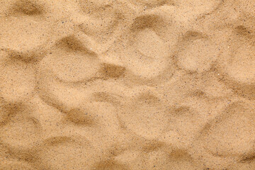 Texture of beach sand with pattern as background, closeup