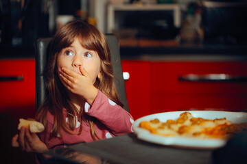 
Child Covering Mouth at Mealtime Feeling Like Not Eating 
Kid acting out during lunch time...