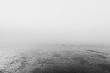 Fototapeta premium Black-and-white fog over a calm ocean. Minimal horizon line and soft gradient sky. Quiet uncertainty and reflection. Ideal for branding headers, posters, and website backgrounds.
