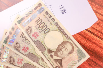 新紙幣一万円札と月謝袋