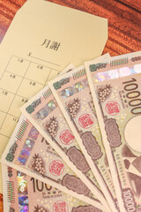 新紙幣一万円札と月謝袋