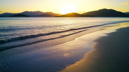 The ocean is calm and the sun is setting