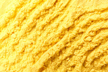 Texture of bright powder pigment with lines as background, closeup