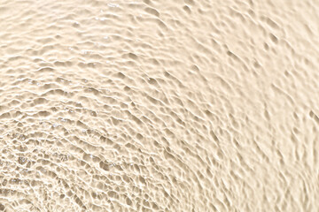 Texture of clean water with ripples on light background