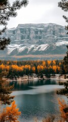 Naklejka premium Autumnal lake nestled in mountain valley.