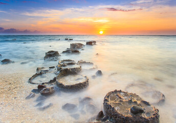 view of the vast blue sea at sunset with the waves like white fo