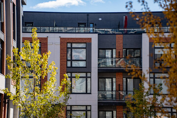 Exterior view of modern apartment building offering luxury units.