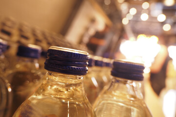 CloseUp Image of Bottled Water Featuring Distinctive Blue Caps