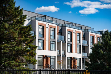 Exterior view of modern apartment building offering luxury units.