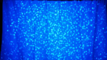 Sparkling BLUE surface as a vibrant backdrop. The image is characterized by cool, slightly dark, and soft lighting with bright, vivid colors. Background with space for copy.