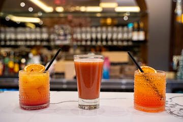 Cocktail drinks on bar background.