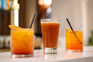 Cocktail drinks on bar background.